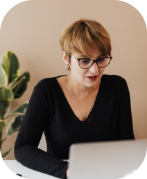 Woman brainstorming ideas on her laptop